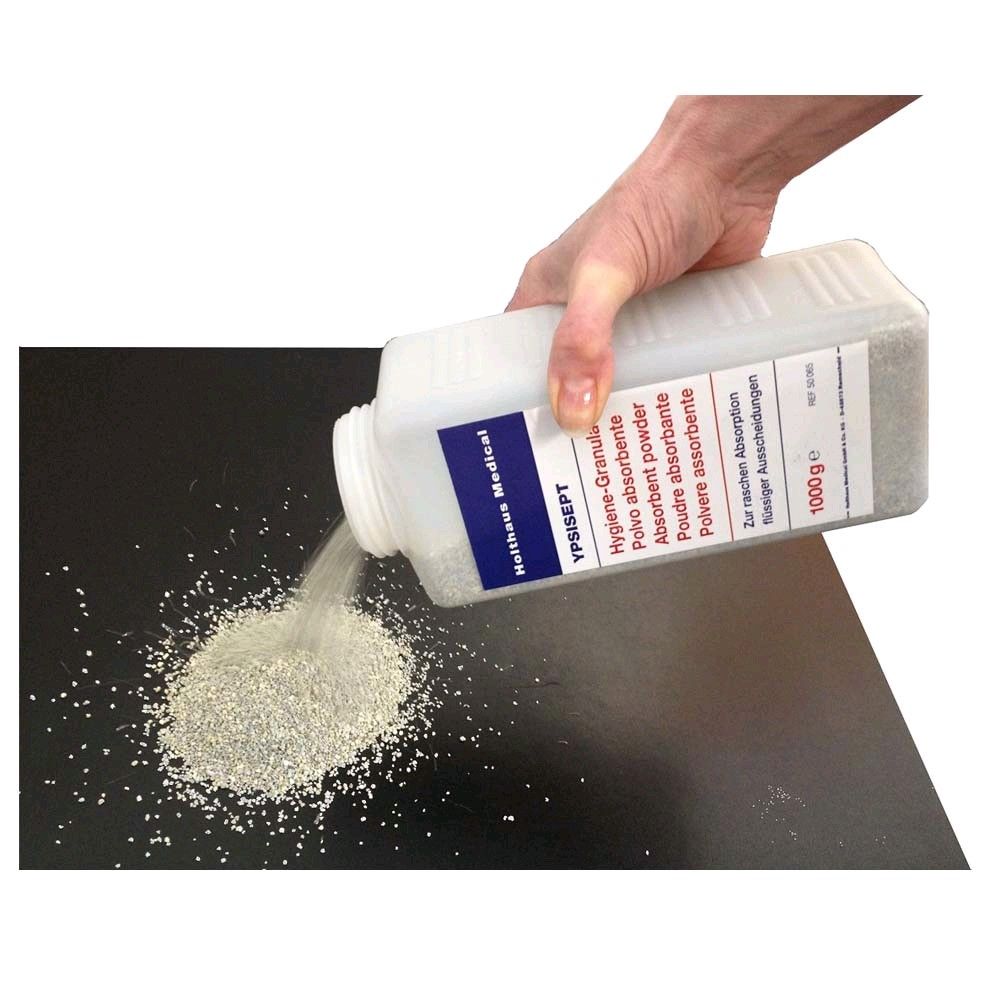 Hygiene-Granulat aus YPSISEPT-Flasche, wird auf dunkle Fläche ausgeschüttet