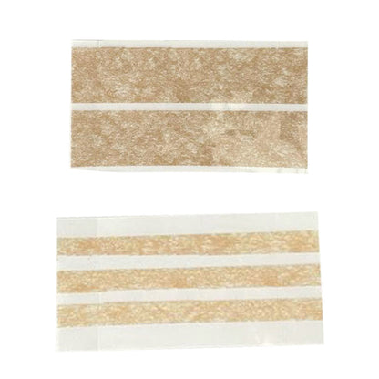 Zwei Wundnahtstreifen auf transparentem Träger, je mit beige Streifen