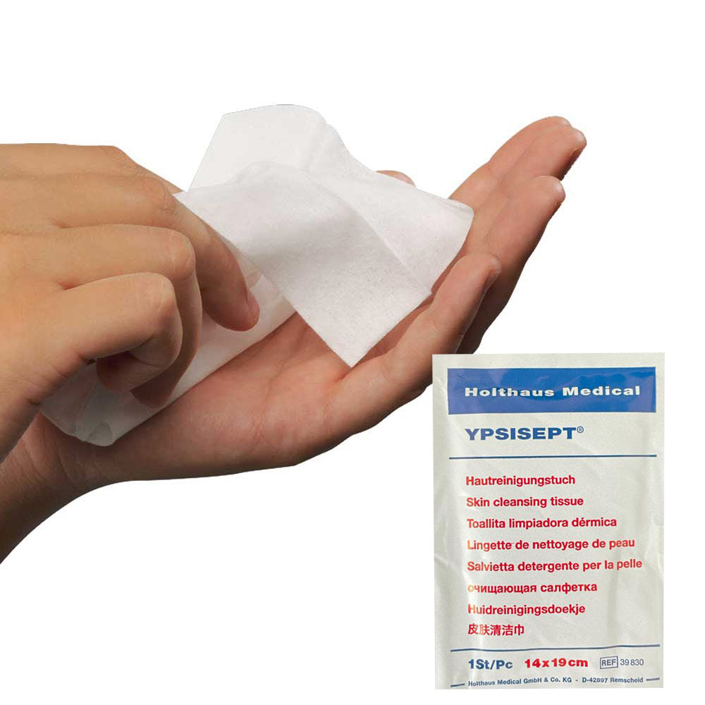 Hautreinigungstuch YPSISEPT®: Tuch in Hand, Packung sichtbar.