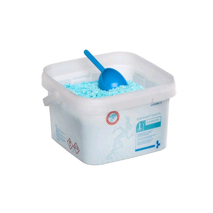 Schülke gigasept® pearls Instrumentendesinfektion: offener Behälter mit Schaufel und blauem Granulat