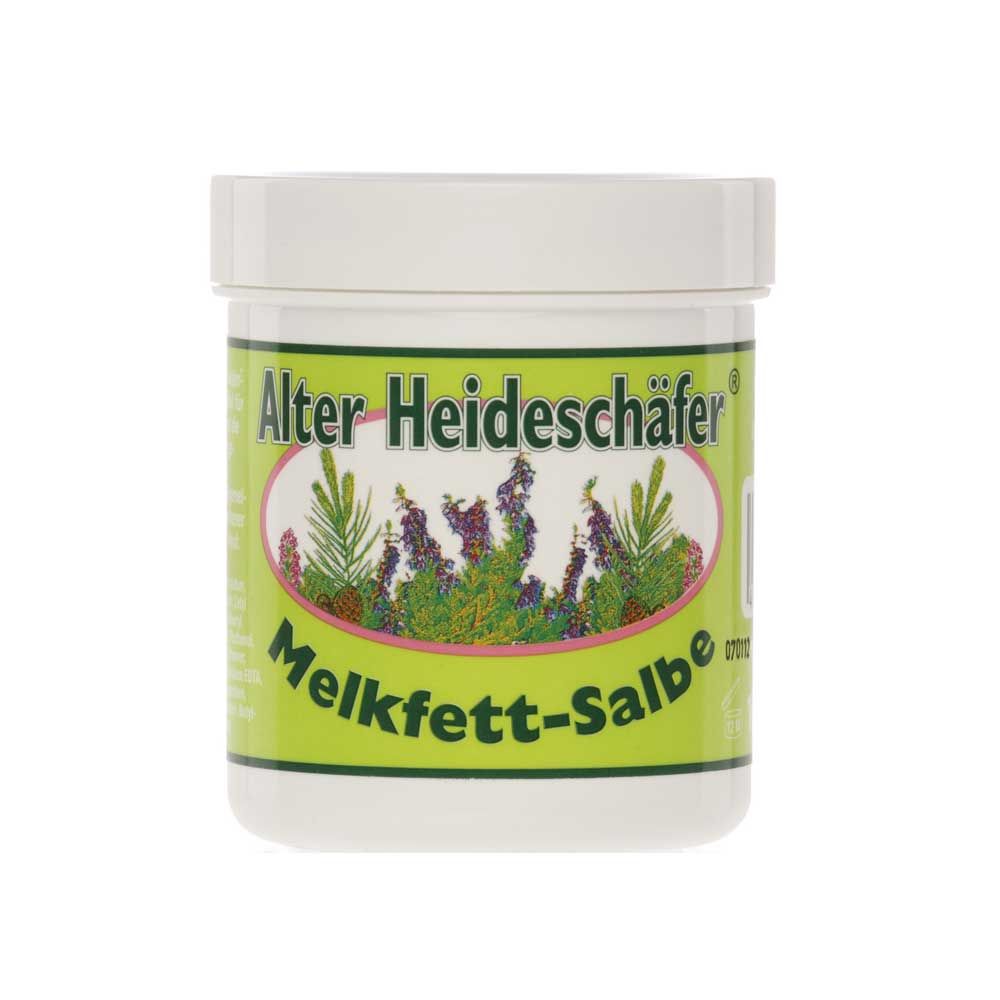 Melkfett-Salbe Alter Heideschäfer® im weißen Tiegel mit grünem Etikett und Pflanzenmotiv