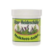 Melkfett-Salbe Alter Heideschäfer® im weißen Tiegel mit grünem Etikett und Pflanzenmotiv