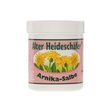 Alter Heideschäfer® Arnika-Salbe im weißen Kunststoffglas mit Deckel, gelbe Blüten und grüne Umrandung