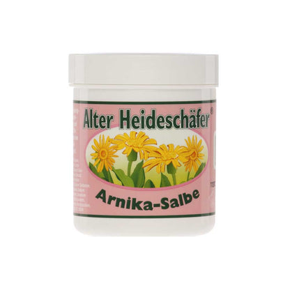 Alter Heideschäfer® Arnika-Salbe im weißen Kunststoffglas mit Deckel, gelbe Blüten und grüne Umrandung