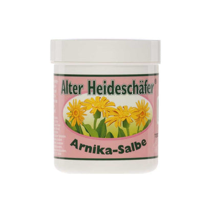 Alter Heideschäfer® Arnika-Salbe im weißen Kunststoffglas mit Deckel, gelbe Arnika-Blüten